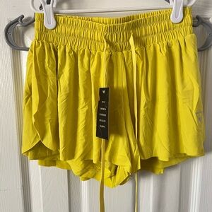 Yellow athletic split leg shorts